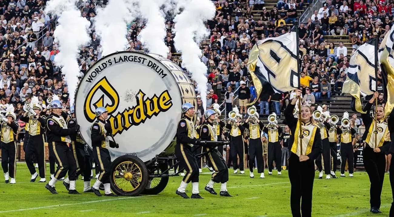 The Purdue All-American Marching Band and the World's Largest Drum on the football field